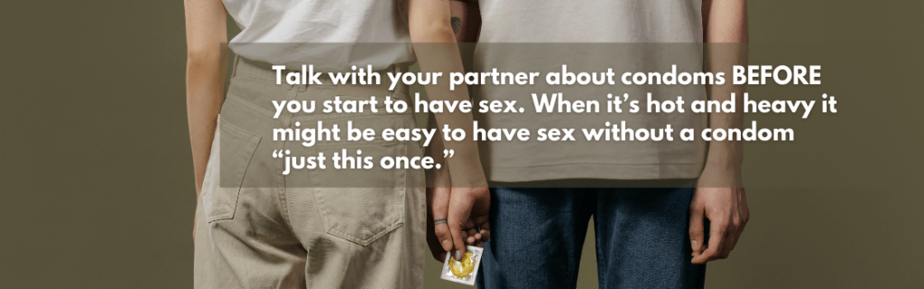 A couple holding a condom