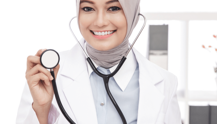 Smiling doctor holding a stethoscope