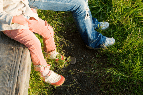 A parent and child sit together