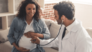 A pregnant woman with her doctor