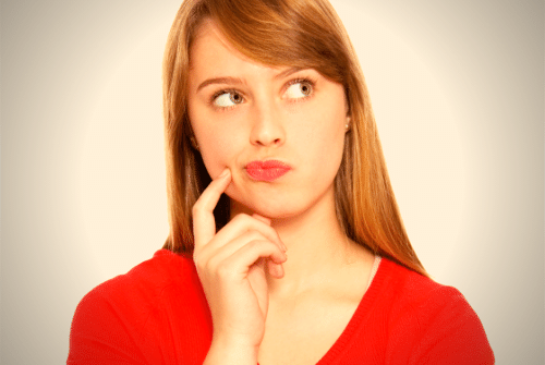 A woman ponders a question