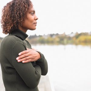 A woman crossing her arms across her chest