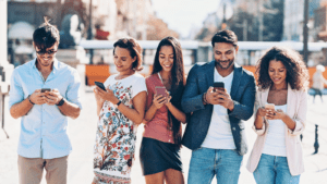 Group of people looking at cell phones
