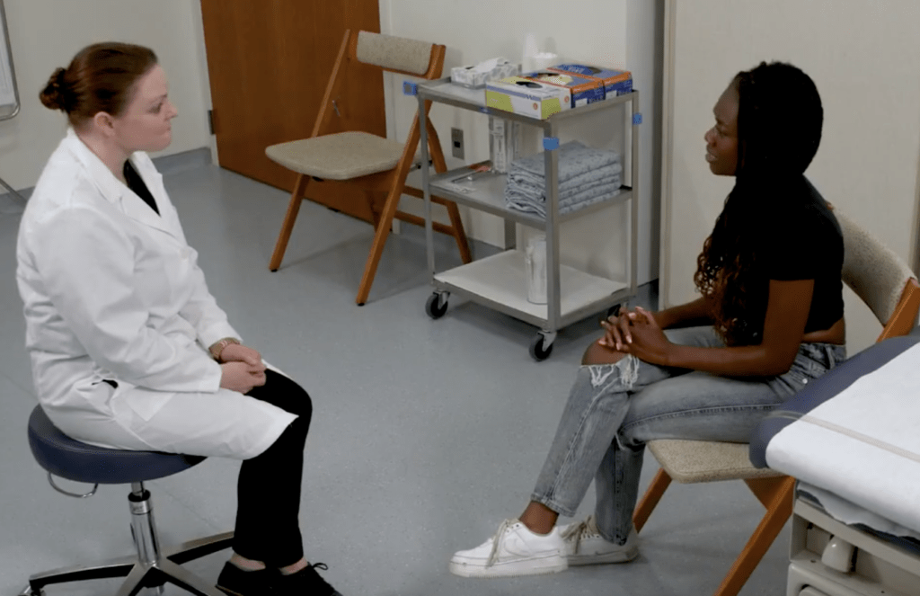 A doctor talking to a patient