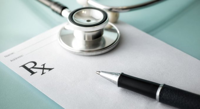 A stethoscope and a pen