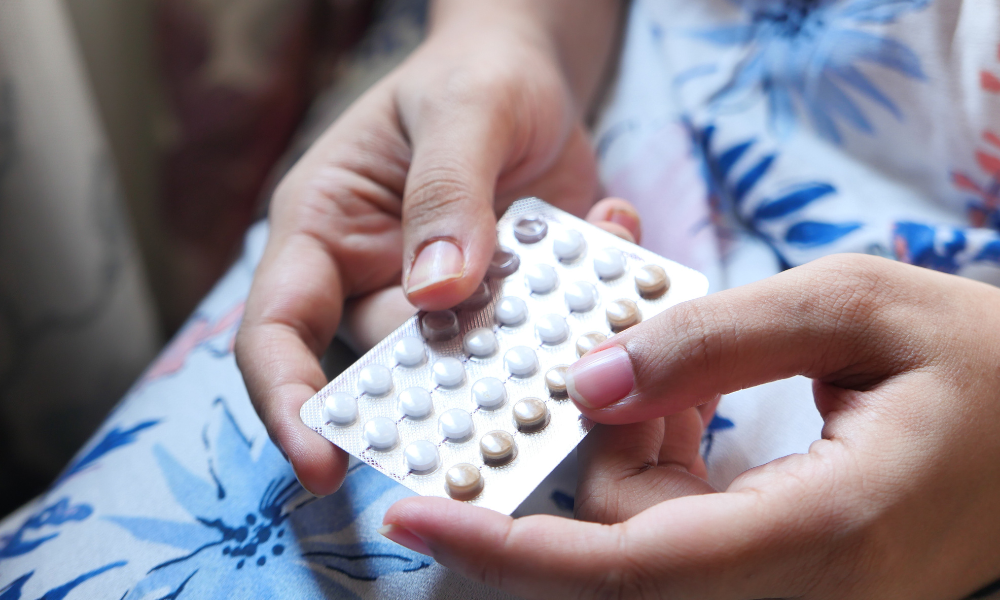 A person holds a pack of birth control pill