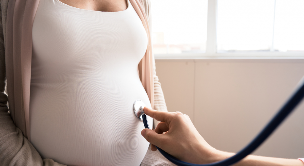 Pregnant person examined by health care provider