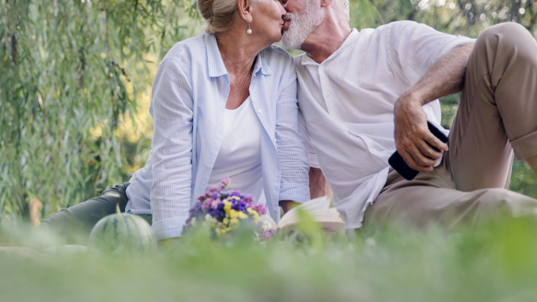 An older couple kissing