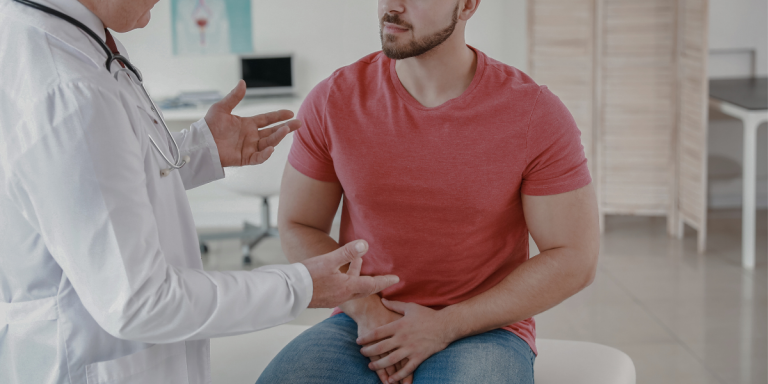 A male patient talks to a health care provider