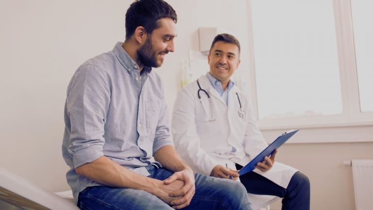 A man speaks with a health care provider