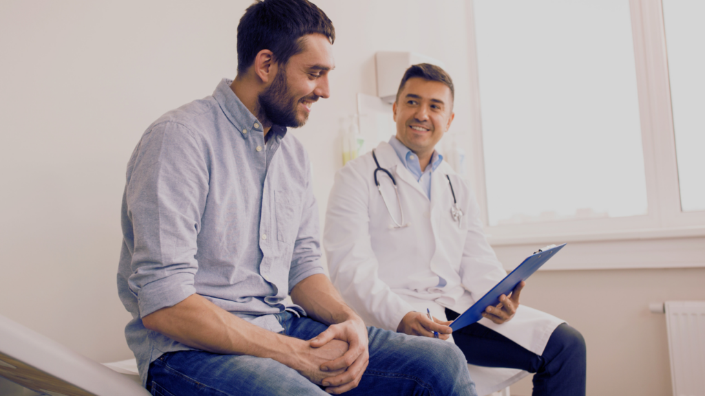 A man speaks with a health care provider
