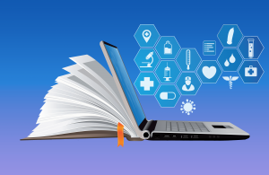 A computer backed by a book