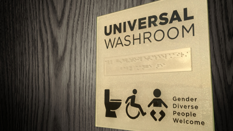 A bathroom sign that reads gender diverse people welcomed