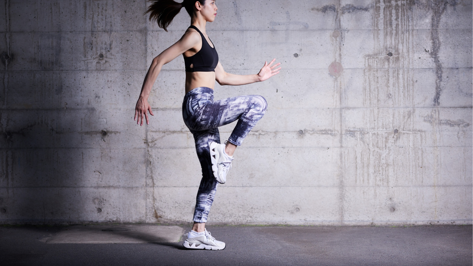A woman jogs in place