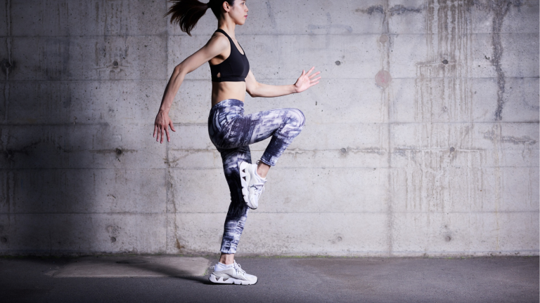 A woman jogs in place