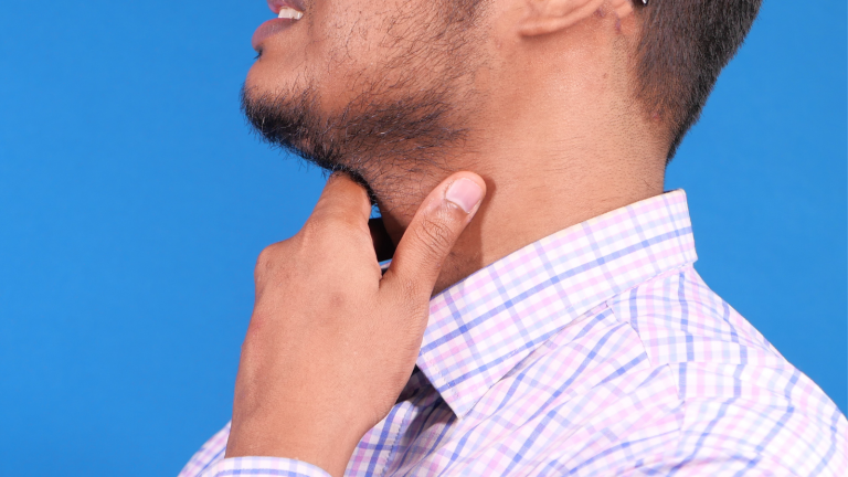 A man hold on to his throat
