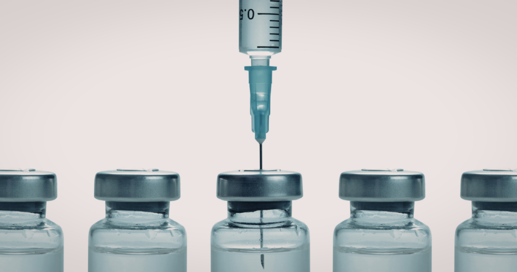A series of vaccine vials with vaccines to prevent STIs