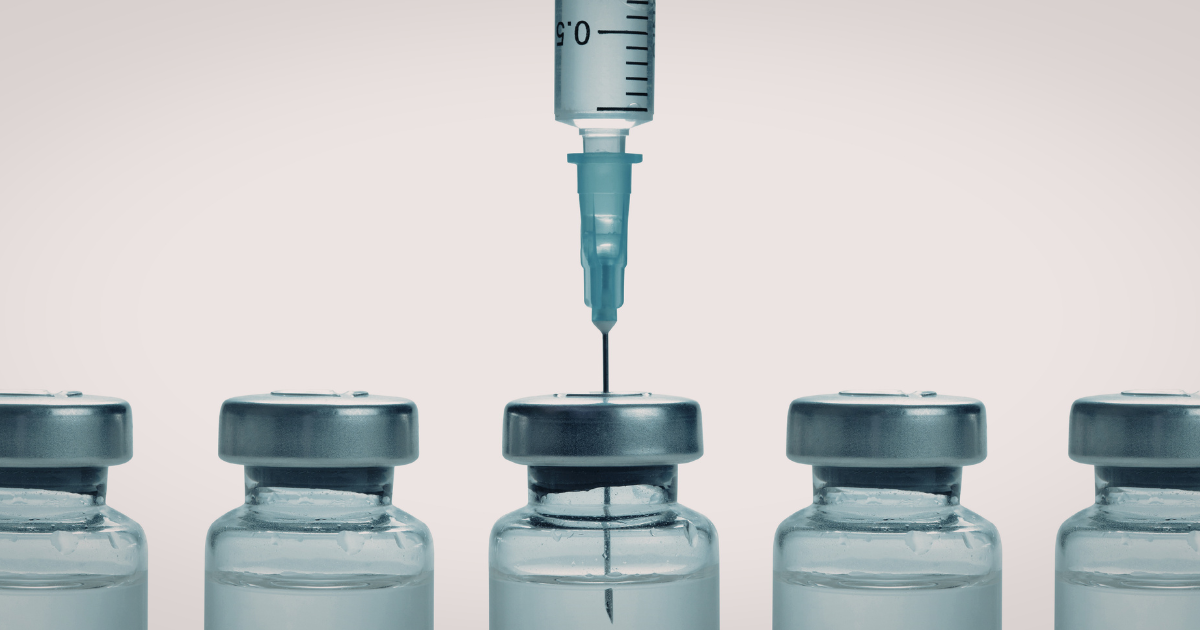 A series of vaccine vials with vaccines to prevent STIs