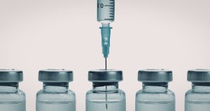 A series of vaccine vials with vaccines to prevent STIs